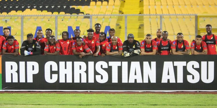 Black Stars players pose with a “RIP Christian Atsu” Banner ahead of Angola qualifier on Thursday