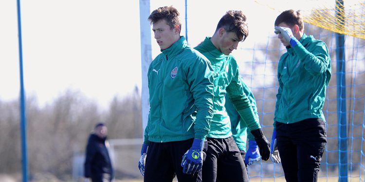 GLOVES OUT. GUN IN : Shaktar U19 goalkeeper temporarily quits football to join Ukraine army as he bids to defend his country